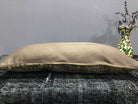 Colorful Turkish throw pillow, shown on the floor.