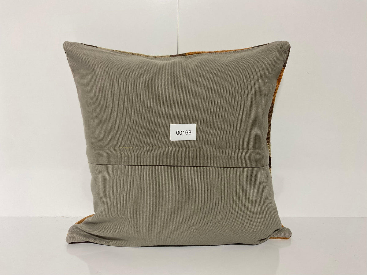 Close-up of the orange Turkish throw pillow showing traditional details, low pile.