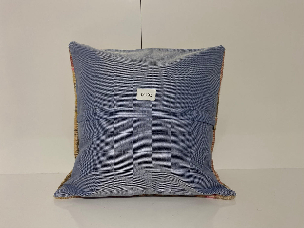 Close-up of the pink Turkish throw pillow showing traditional details, low pile.