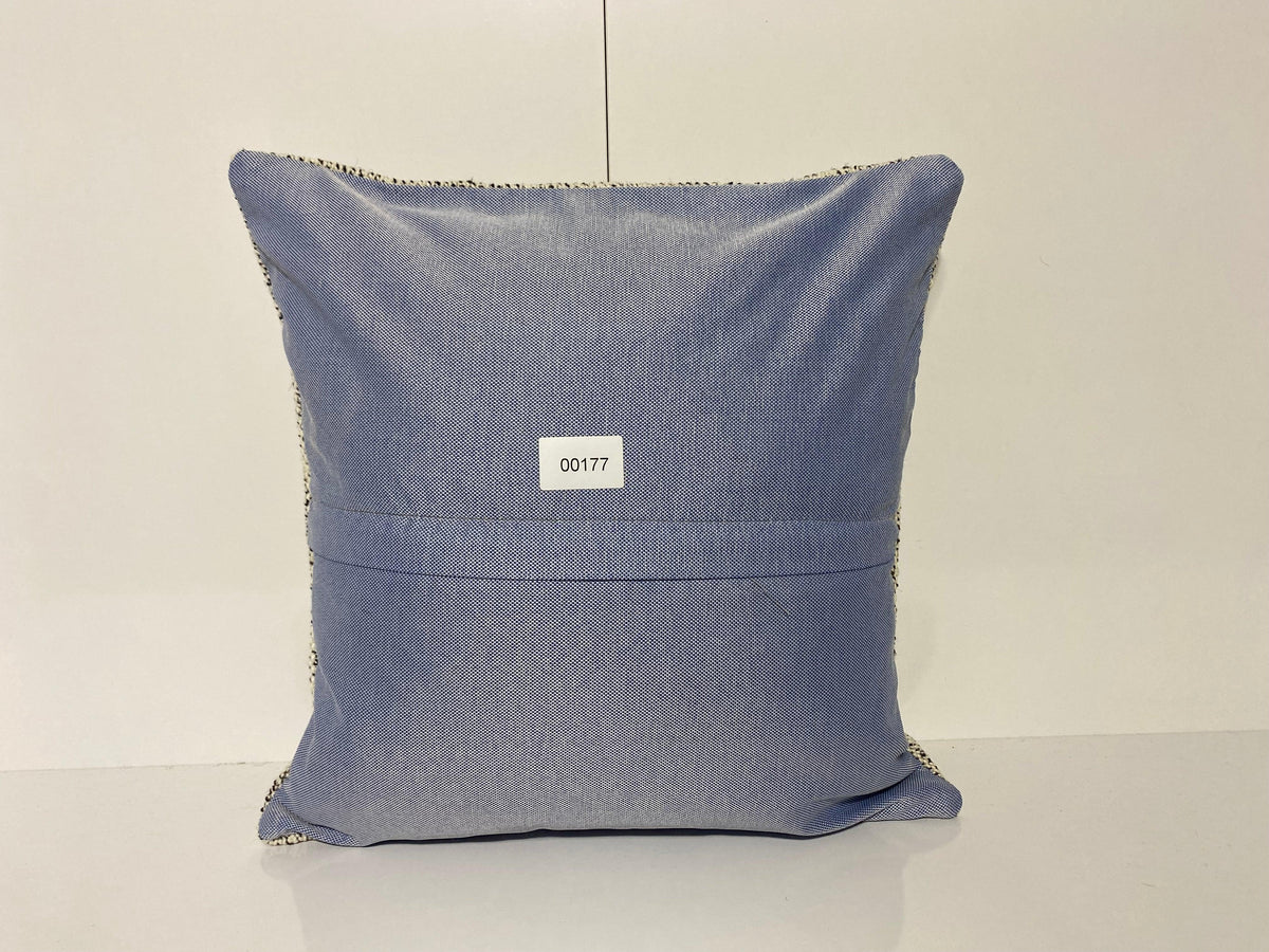 Close-up of the white Turkish throw pillow showing neutral details, low pile.