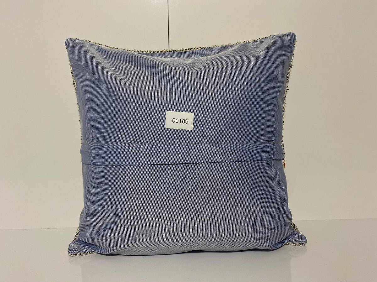 Close-up of the white Turkish throw pillow showing neutral details, low pile.