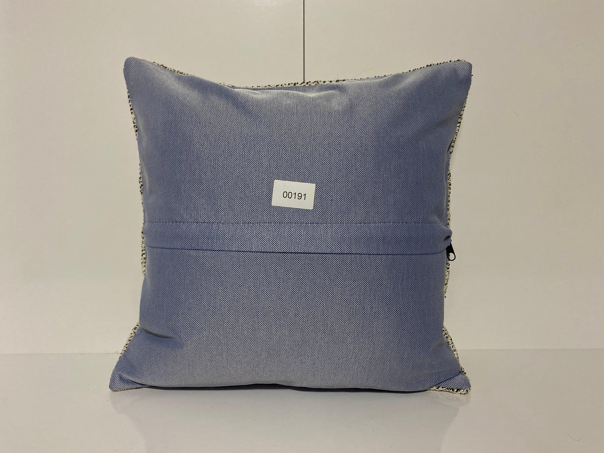 Close-up of the white Turkish throw pillow showing traditional details, low pile.