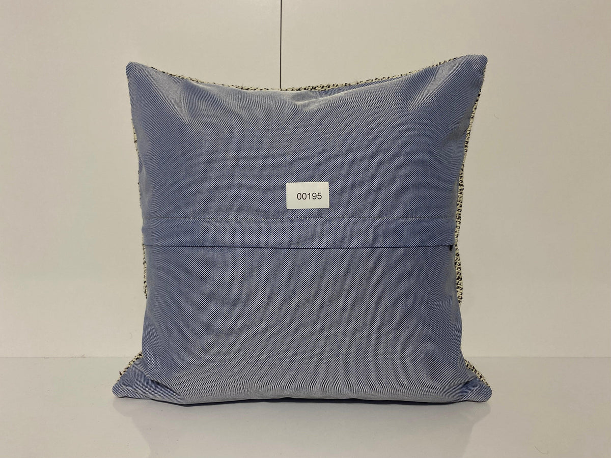 Close-up of the white Turkish throw pillow showing traditional details, low pile.