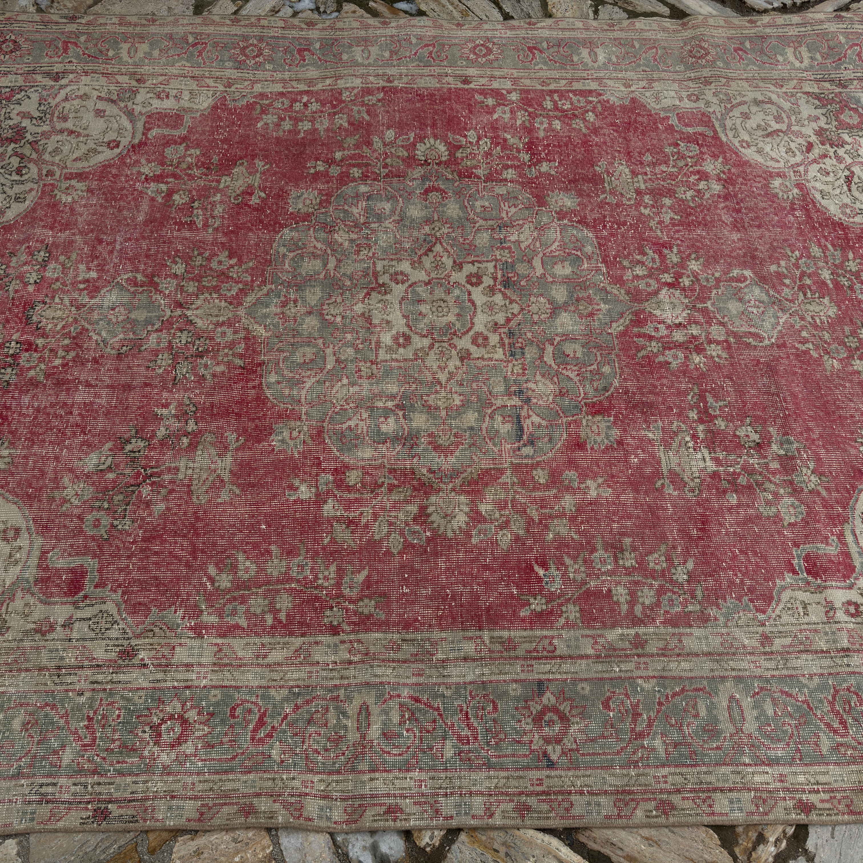 1970s red Turkish traditional anatolian rug with traditional design, hand-knotted weave and low pile.