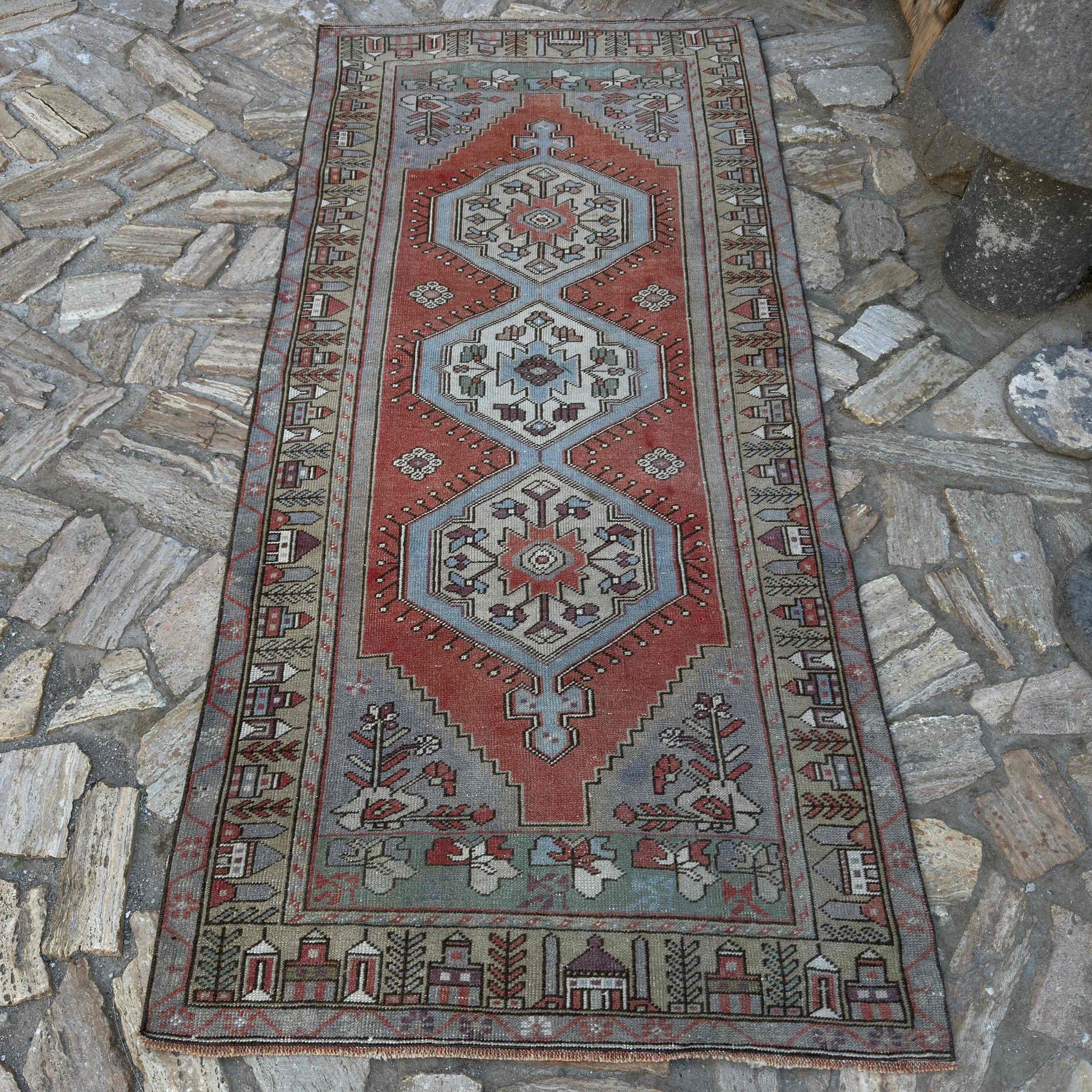 Red 4' x 8' Turkish traditional rug in wool and cotton, shown on the floor.