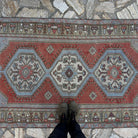 1970s red Turkish traditional rug with traditional design, hand-knotted weave and low pile.