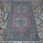 Pink 4' x 8' traditional turkish rug in wool and cotton, shown on the floor.