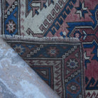 1970s red Turkish traditional vintage rug with traditional design, hand-knotted weave and low pile.