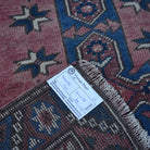 Red 2' x 4' Turkish traditional vintage rug from the 1970s with traditional design.