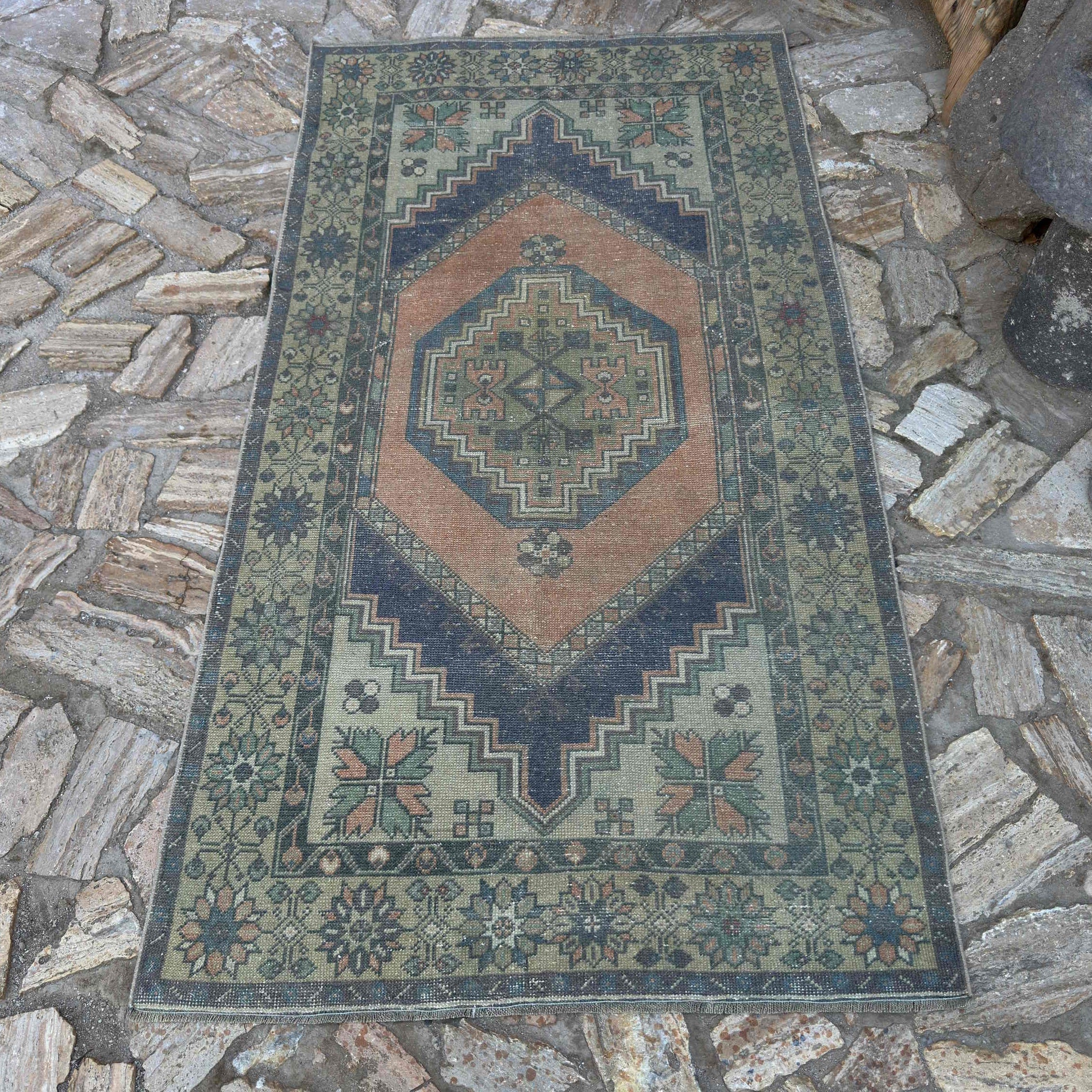 Orange 4' x 6' Turkish traditional vintage rug in wool and cotton, shown on the floor.