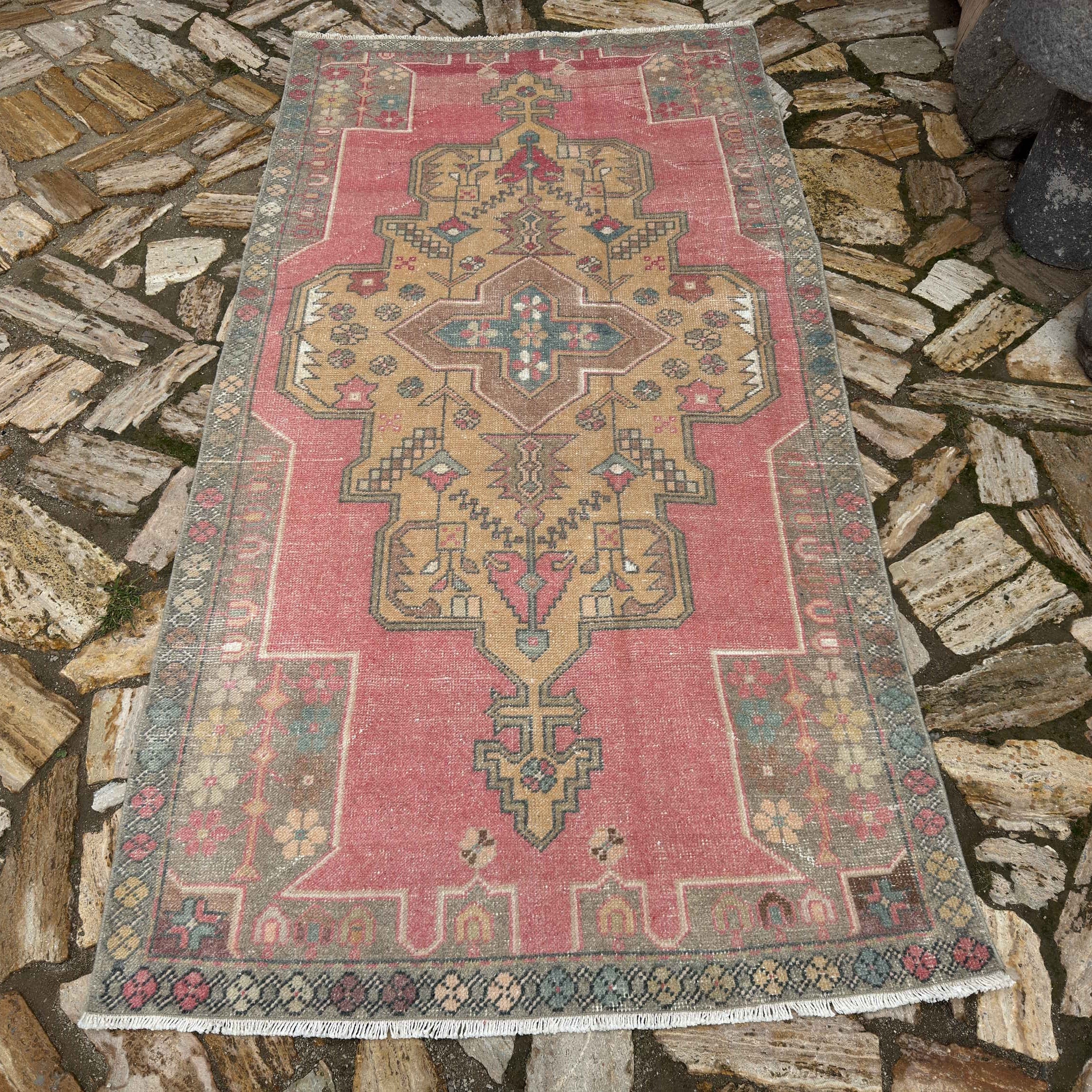 Pale Pink 4' x 7' Turkish traditional vintage rug in wool and cotton, shown on the floor.