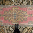 1970s pale pink Turkish traditional vintage rug with traditional design, hand-knotted weave and low pile.