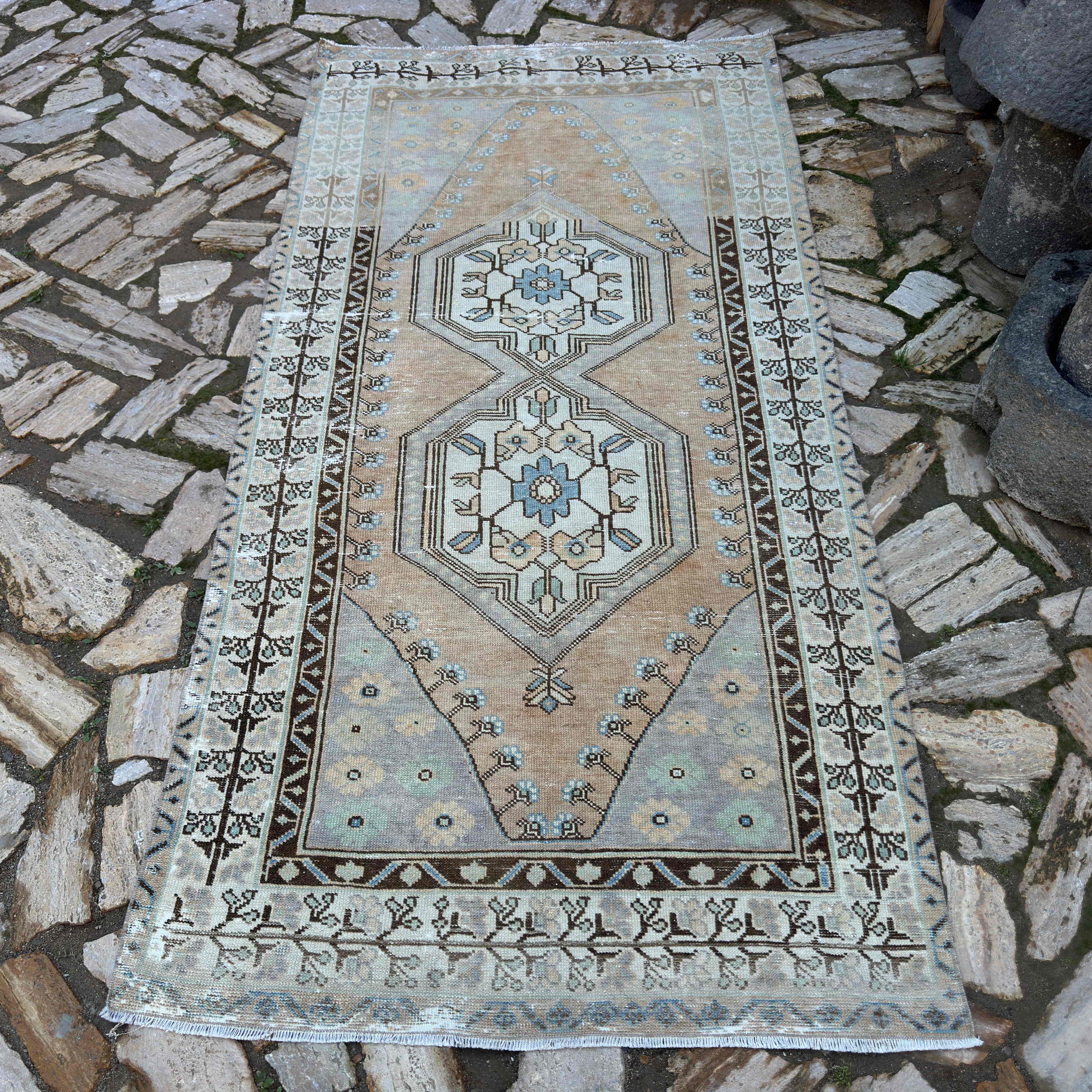 Pale Orange 4' x 8' turkish area rug in wool and cotton, shown on the floor.