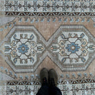 1970s pale orange turkish area rug with traditional design, hand-knotted weave and low pile.
