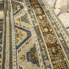 Close-up of the blue turkish area rug showing traditional details, hand-knotted weave, wool and cotton and low pile.