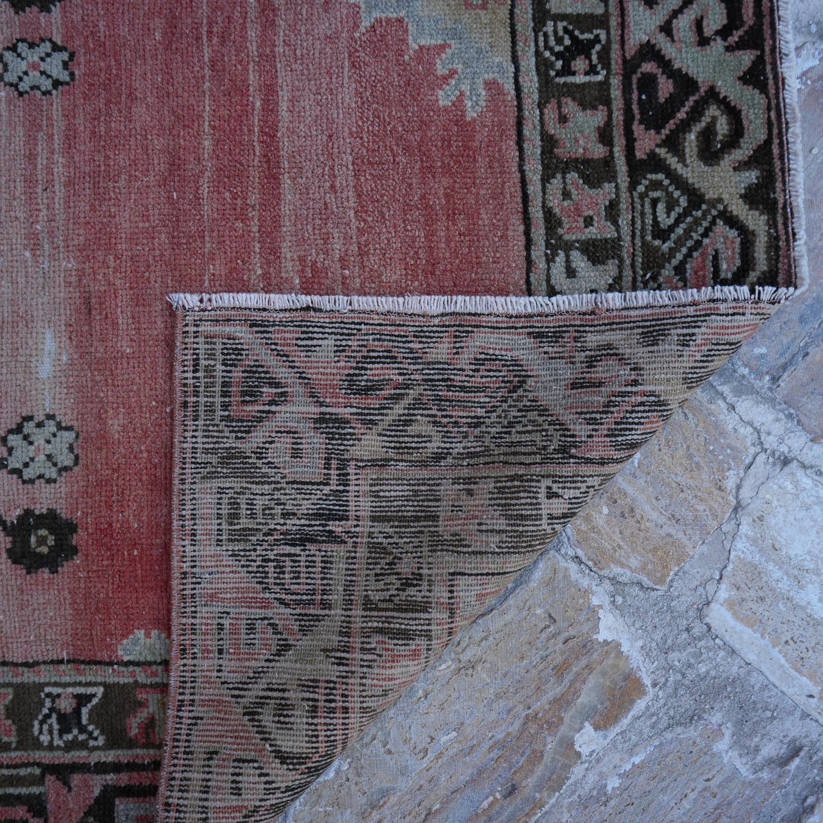 1970s red turkish area rug, hand-knotted weave and low pile.