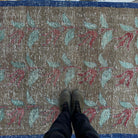 1970s pale brown turkish floral rug with floral design, hand-knotted weave and low pile.