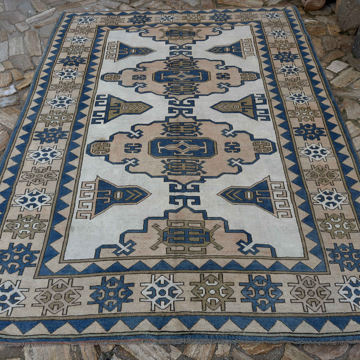 Pale Blue 7' x 9' turkish geometric carpet in wool and cotton, shown on the floor.