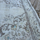 Close-up of the brown turkish medallion rug showing medallion details, hand-knotted weave, wool and cotton and low pile.
