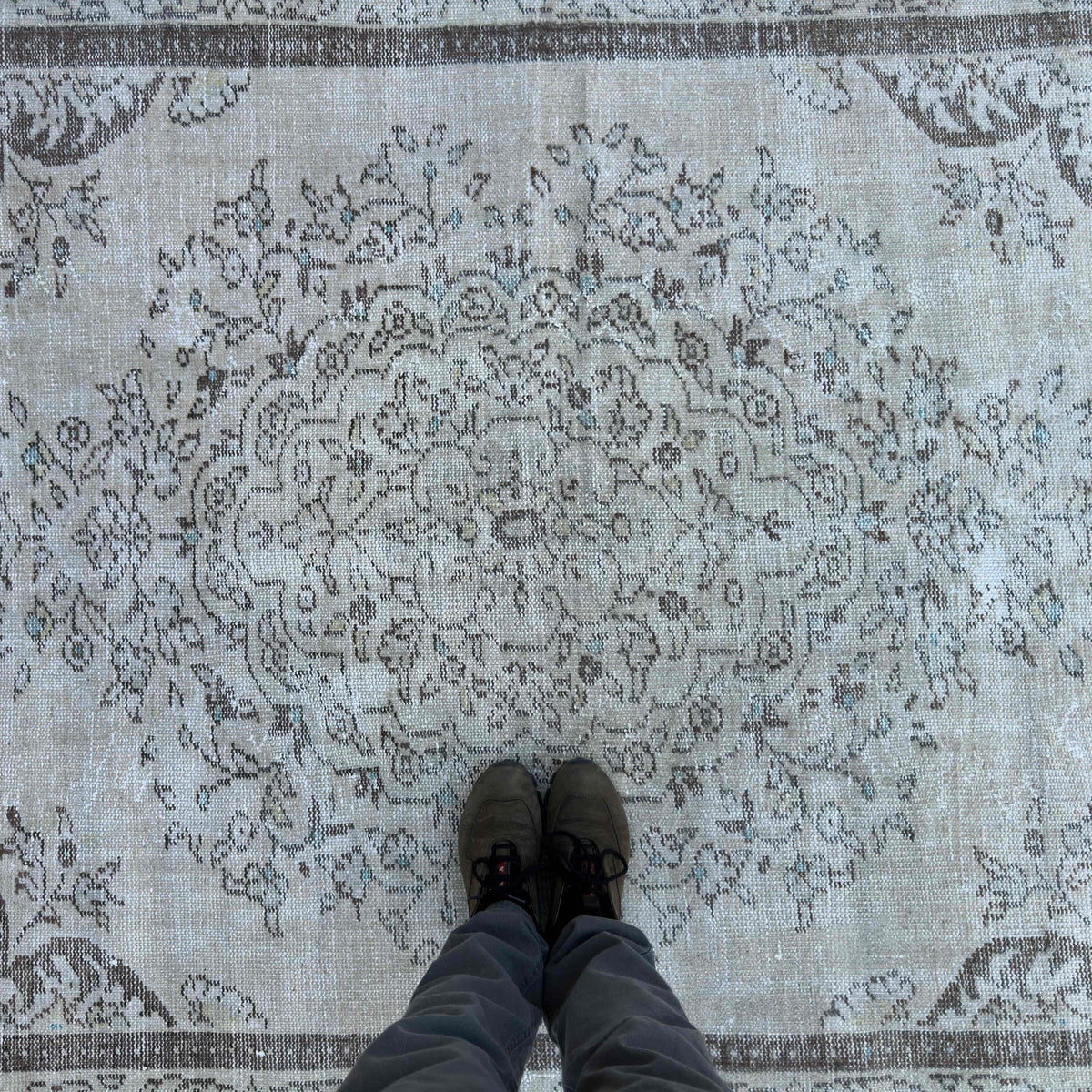 1970s brown turkish medallion rug with medallion design, hand-knotted weave and low pile.