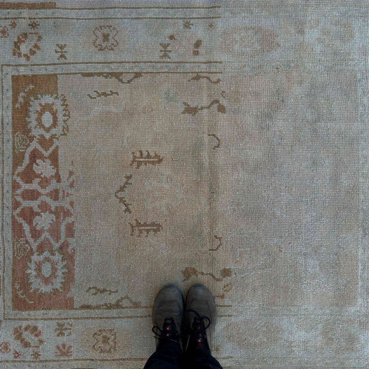 1970s beige turkish oushak rug with neutral design, hand-knotted weave and low pile.