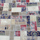 1970s red turkish patchwork rug with patchwork design, hand-knotted weave and low pile.