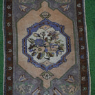 Close-up of the gray turkish rug showing traditional details, hand-knotted weave, wool and cotton and low pile.