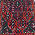 Close-up of the orange turkish rug showing traditional details, flatweave construction, wool and cotton and low pile.