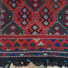 Orange 2' x 4' turkish rug in wool and cotton, shown on the floor.