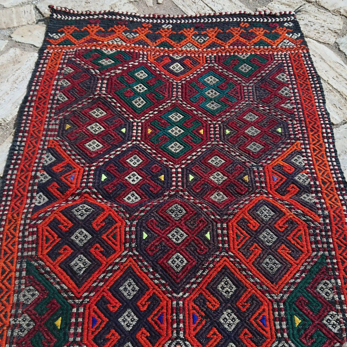 1970s orange turkish rug with traditional design, flatweave construction and low pile.