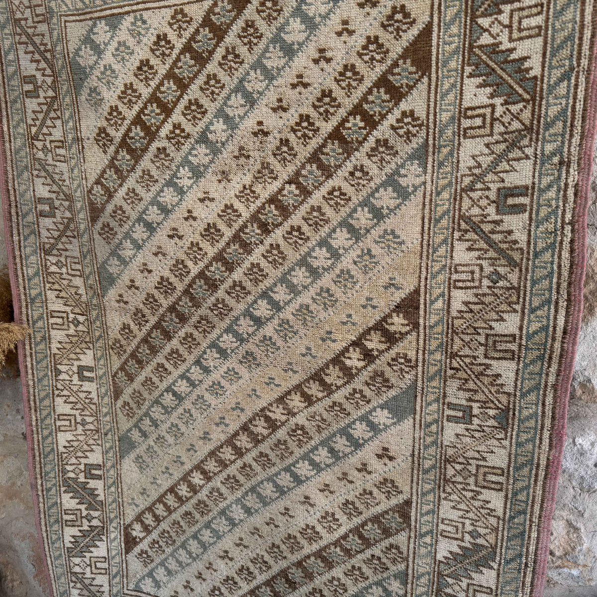 Pale Blue 4' x 5' turkish rug in wool and cotton, shown on the floor.