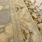 Close-up of the gray turkish rug showing traditional details, hand-knotted weave, wool and cotton and low pile.
