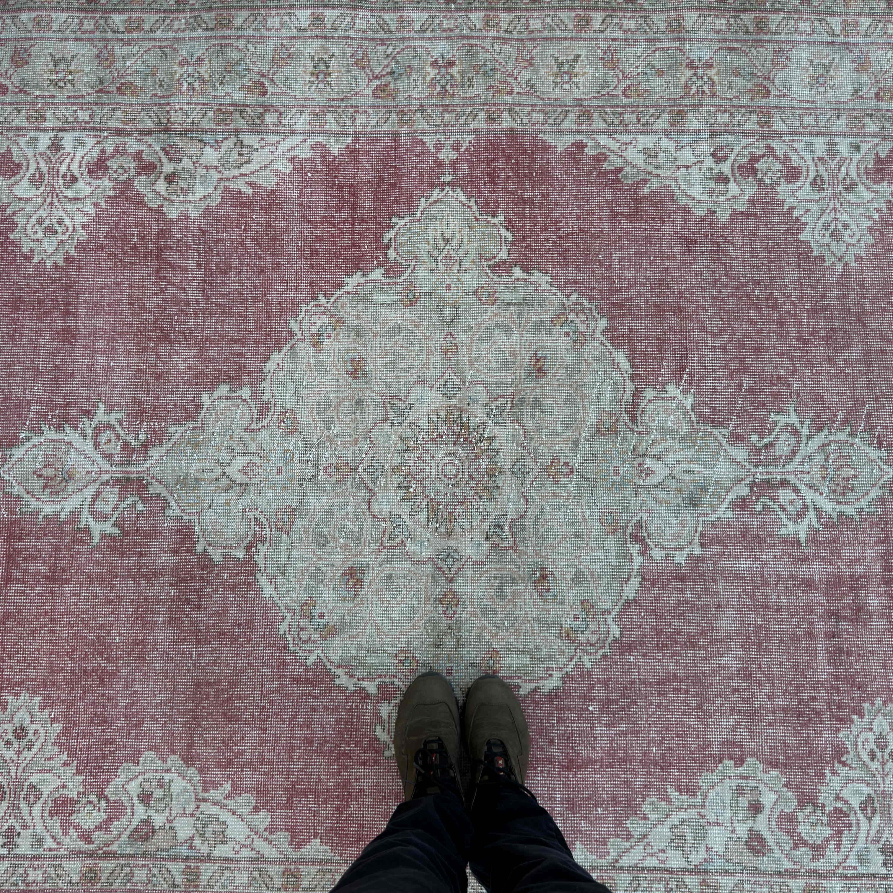1970s red turkish rug with medallion design, hand-knotted weave and low pile.