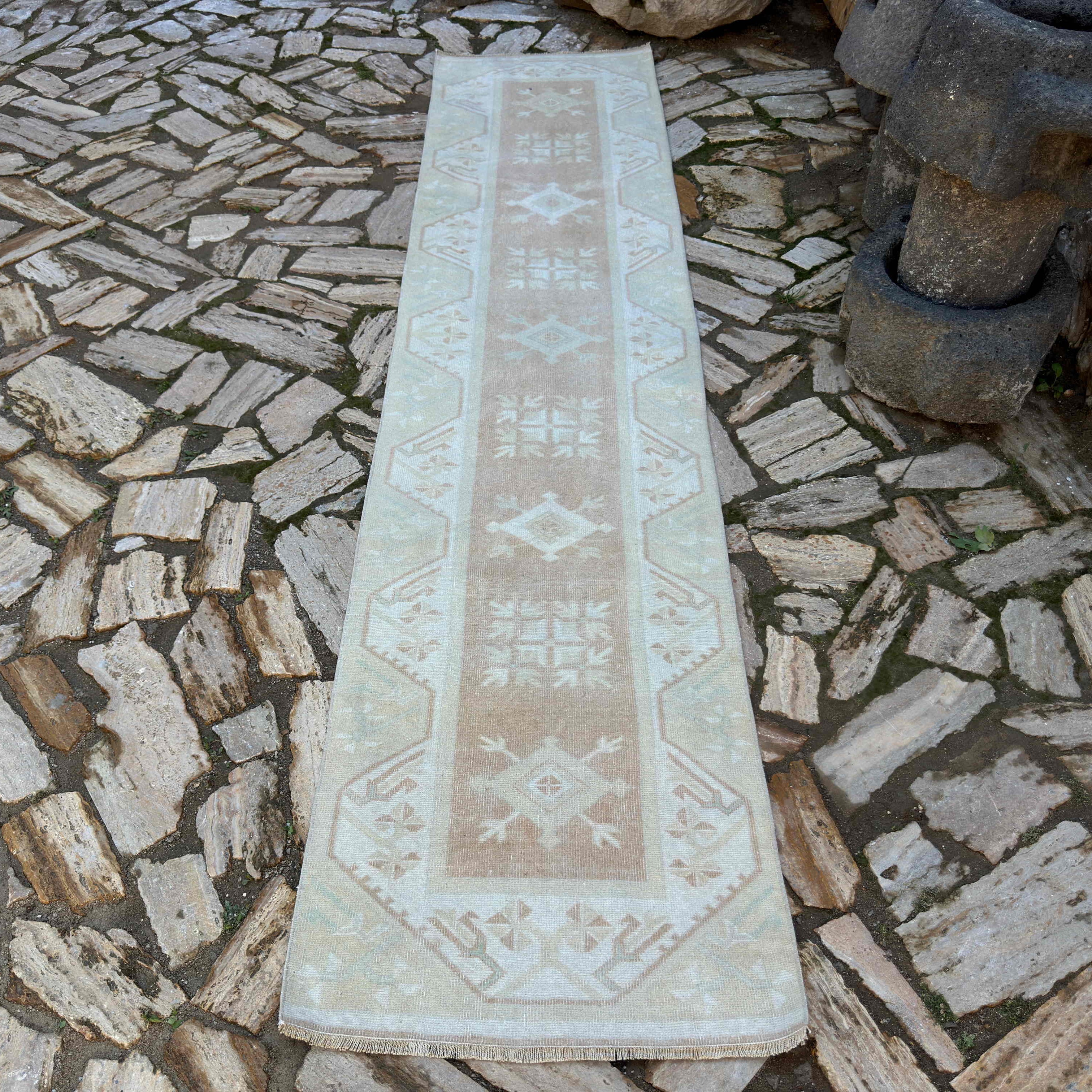 Beige 2' x 10' turkish runner rug in wool and cotton, shown on the floor.