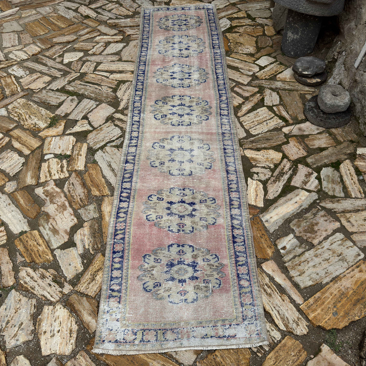 Pale Pink 2' x 10' turkish runner rug in wool and cotton, shown on the floor.