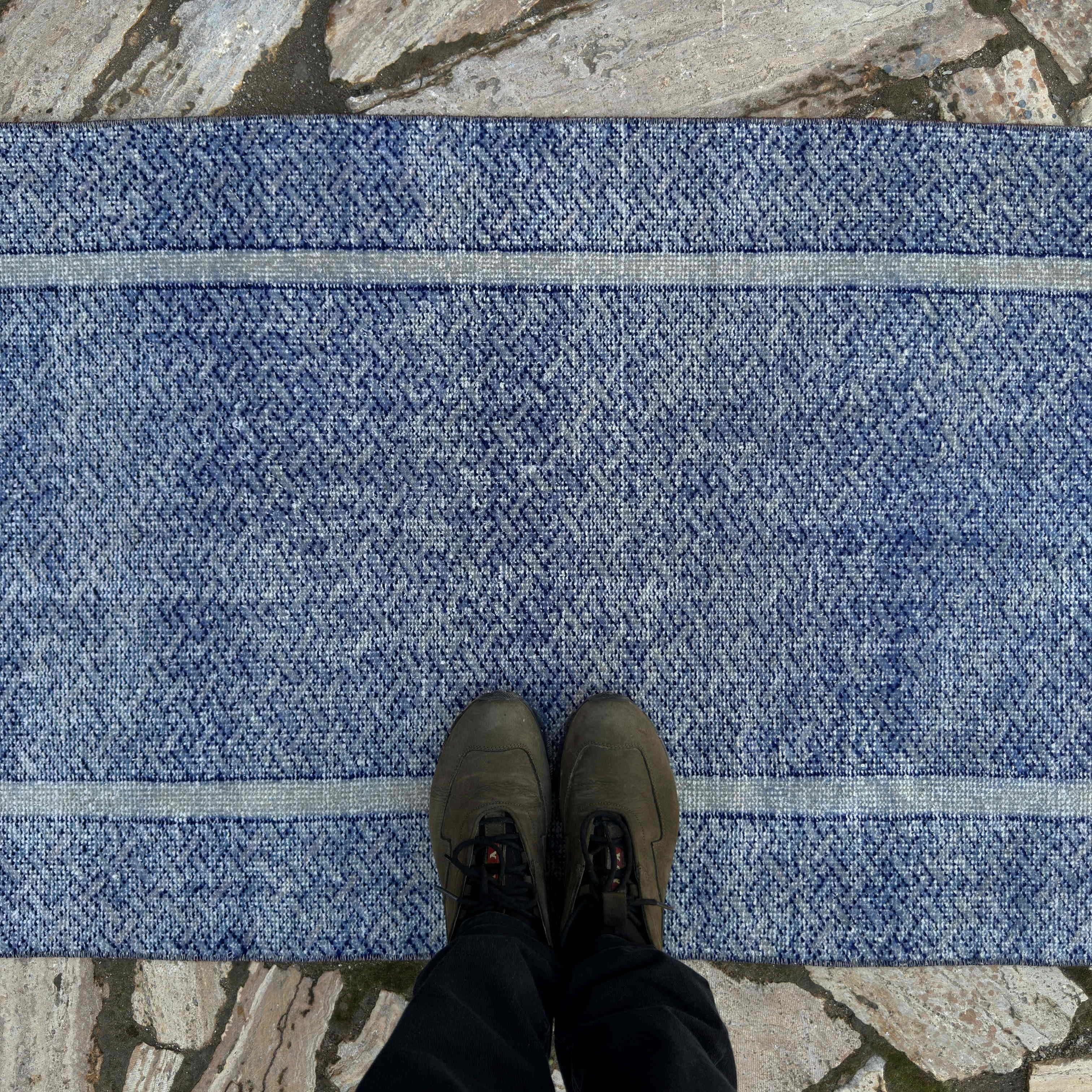 1970s blue turkish runner rug with traditional design, hand-knotted weave and low pile.