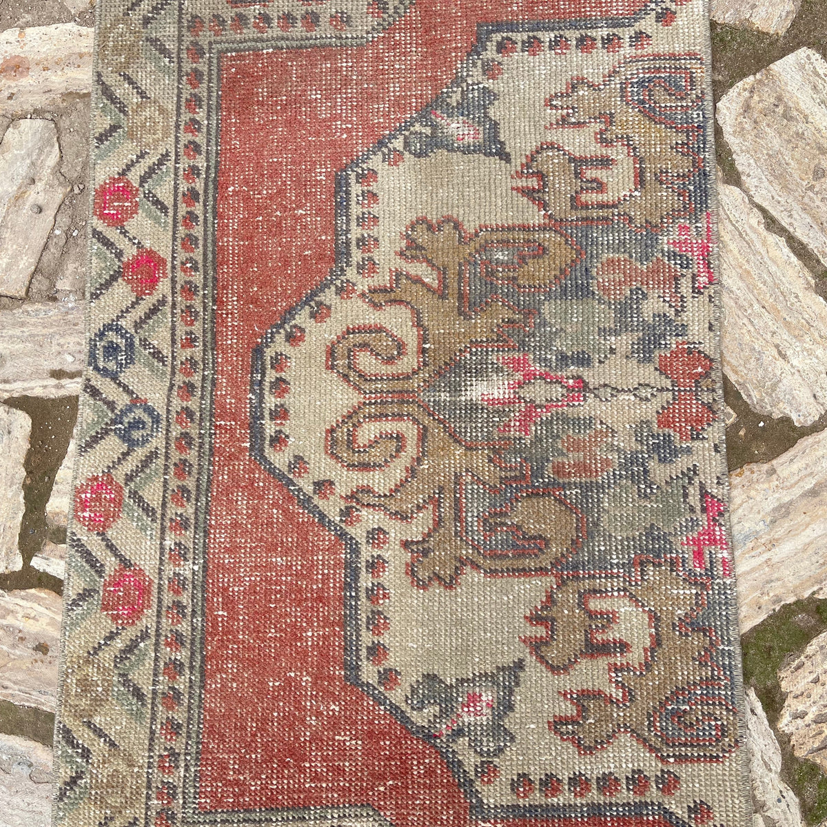 1970s red turkish runner rug with traditional design, hand-knotted weave and low pile.