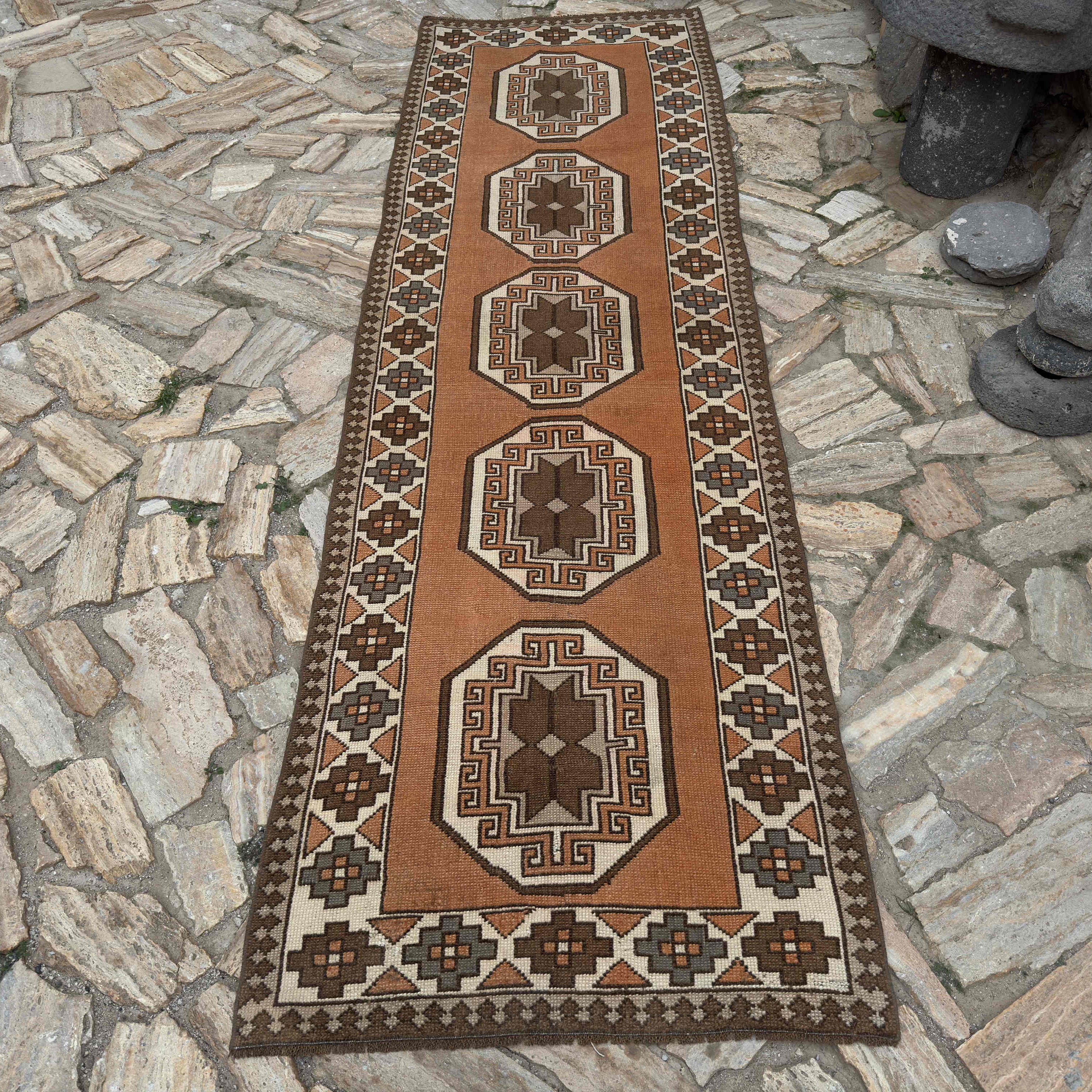 Pale Orange 3' x 10' turkish runner rug in wool and cotton, shown on the floor.
