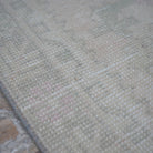 Pale Pink 3' x 10' turkish runner rug in wool and cotton, shown on the floor.