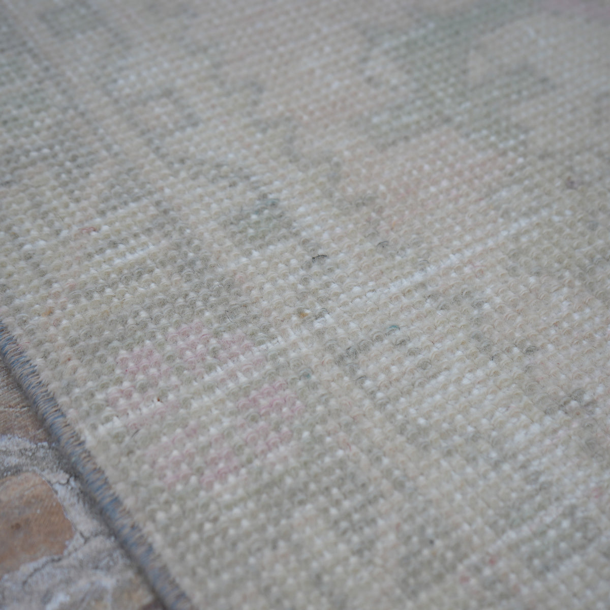 Pale Pink 3' x 10' turkish runner rug in wool and cotton, shown on the floor.