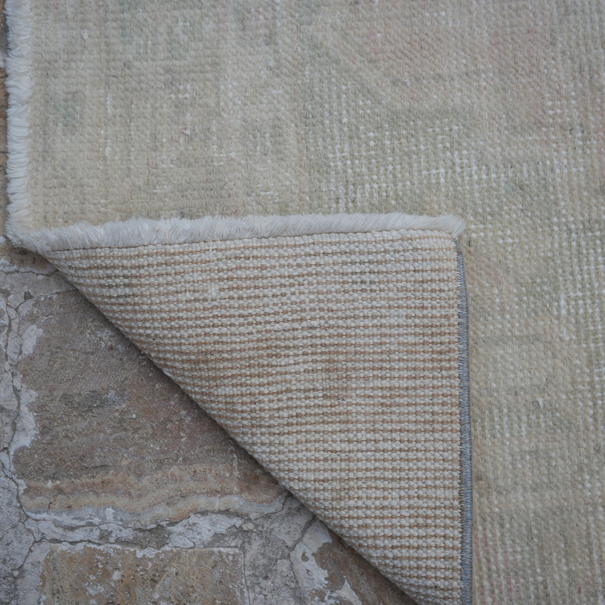 1970s pale pink turkish runner rug with traditional design, hand-knotted weave and low pile.