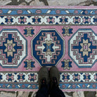 1970s pink turkish runner rug with traditional design, hand-knotted weave and low pile.