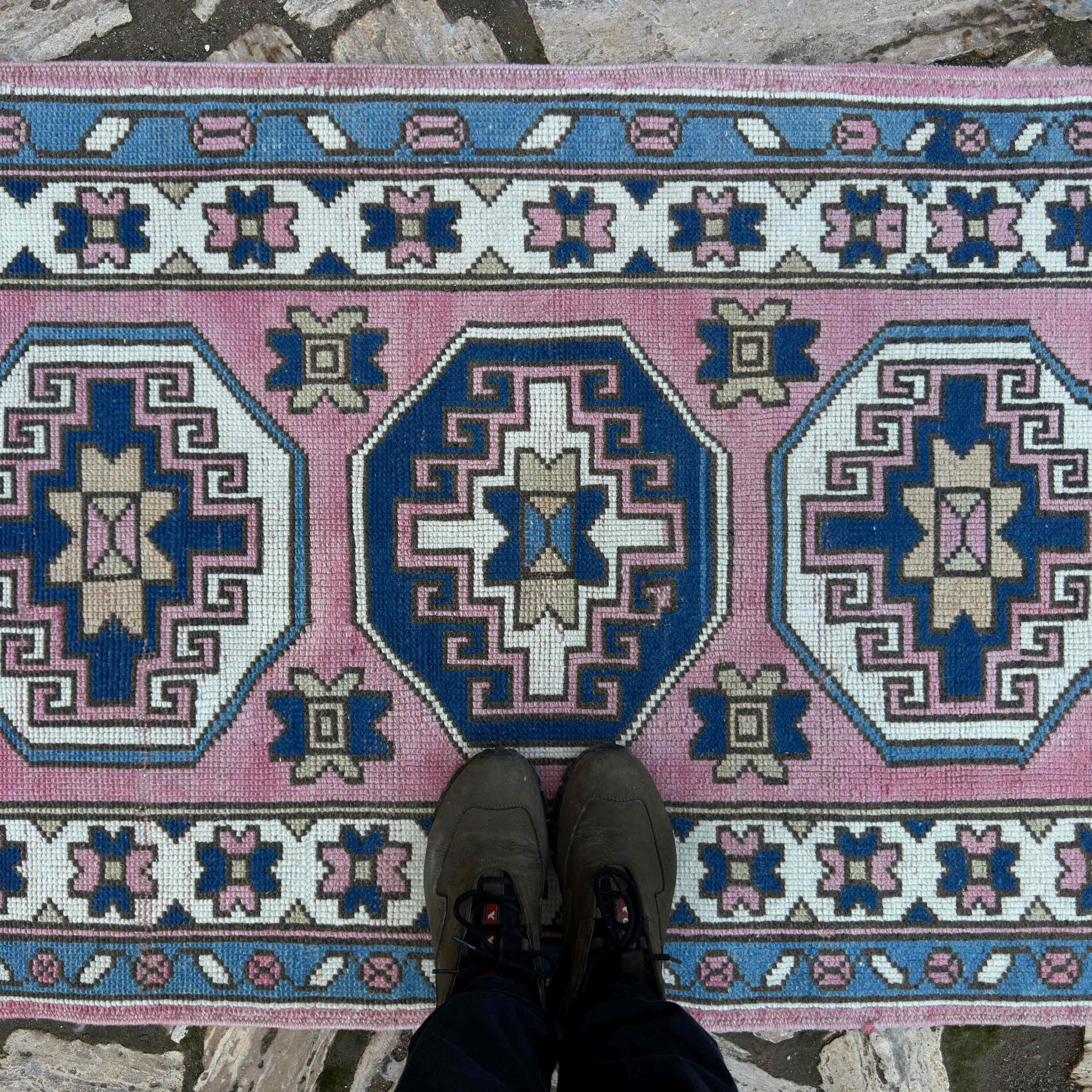 1970s pink turkish runner rug with traditional design, hand-knotted weave and low pile.