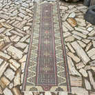 Beige 3' x 9' turkish runner rug in wool and cotton, shown on the floor.