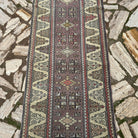 1970s beige turkish runner rug with geometric design, hand-knotted weave and low pile.