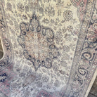 Blue 6' x 10' turkish traditional rug in wool and cotton, shown on the floor.
