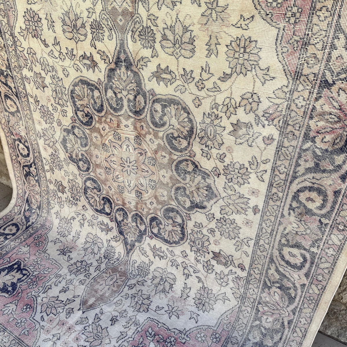 Blue 6' x 10' turkish traditional rug in wool and cotton, shown on the floor.