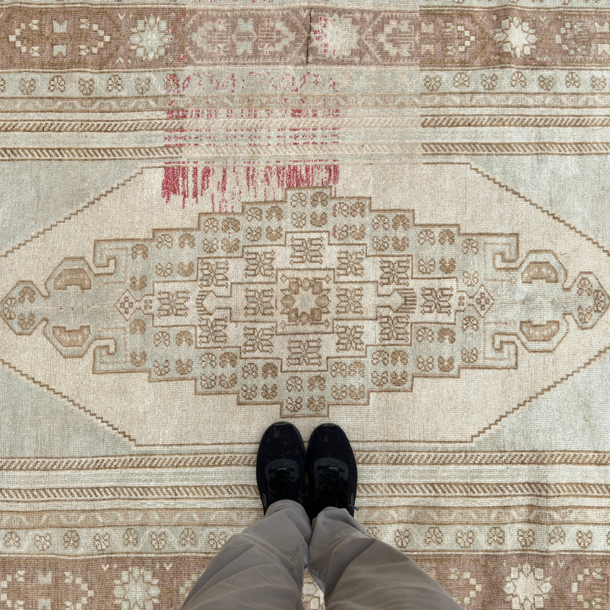 1970s brown turkish wool rug with medallion design, hand-knotted weave and low pile.