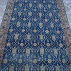 Close-up of the blue Turkish unique vintage rug showing geometric details, hand-knotted weave, wool and cotton and low pile.