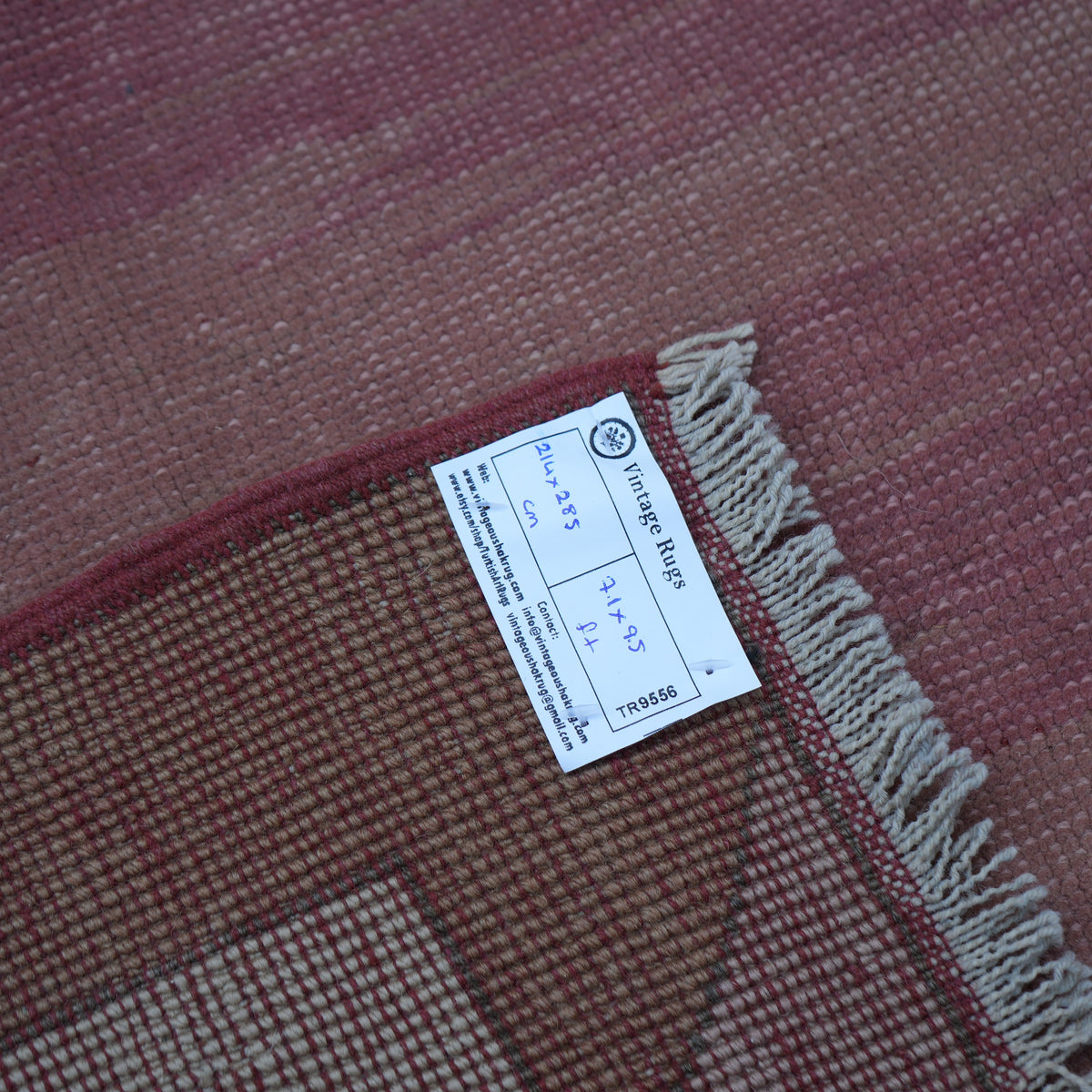Pink 7' x 9' Turkish unique vintage rug from the 1970s with geometric design.
